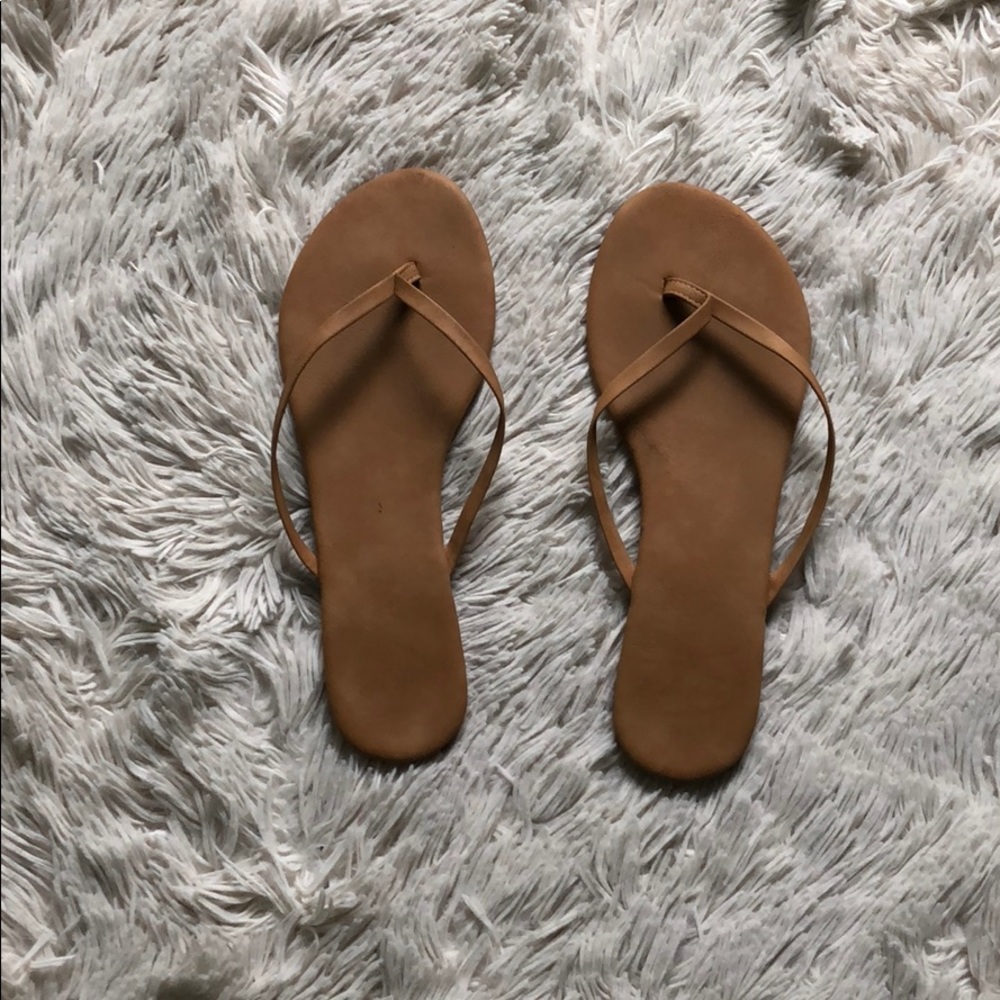 Light brown flip flops